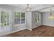 Sun-filled dining area features hardwood floors, modern lighting, and backyard views at 397 Lovejoy Cir, Powder Springs, GA 30127
