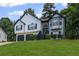 Inviting home with a well-maintained lawn, two-car garage and a classic architectural style at 397 Lovejoy Cir, Powder Springs, GA 30127