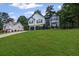 Two-story home with a traditional design and manicured front lawn at 397 Lovejoy Cir, Powder Springs, GA 30127