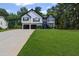 Charming two-story home with a well-maintained lawn and a two-car garage at 397 Lovejoy Cir, Powder Springs, GA 30127