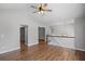 Spacious living room with hardwood floors, ceiling fan, and neutral paint, offering ample natural light at 397 Lovejoy Cir, Powder Springs, GA 30127