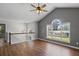Bright upstairs living room showcasing hardwood floors, vaulted ceiling and large windows for natural light at 397 Lovejoy Cir, Powder Springs, GA 30127