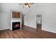 Inviting living room with fireplace, vaulted ceiling and hardwood flooring, perfect for gatherings at 397 Lovejoy Cir, Powder Springs, GA 30127
