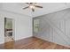 Spacious main bedroom features wood-look floors, tray ceilings, and ensuite bathroom at 397 Lovejoy Cir, Powder Springs, GA 30127