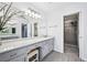 Bright bathroom features a gray vanity with white marble countertop and a walk-in shower at 5427 Trentham Dr, Atlanta, GA 30338