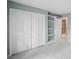 Bedroom featuring wall-to-wall carpeting and storage closets with access to second story staircase at 5427 Trentham Dr, Atlanta, GA 30338