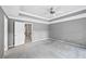 Bedroom with neutral walls, carpeted floor, and tray ceiling at 5427 Trentham Dr, Atlanta, GA 30338