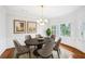 Dining room with a chandelier, a table, and wall trim with neutral tones perfect for entertaining at 5427 Trentham Dr, Atlanta, GA 30338