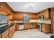 Kitchen with stainless steel appliances, granite counters, and wooden cabinetry at 5427 Trentham Dr, Atlanta, GA 30338