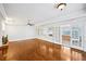 Bright living room with hardwood floors, fireplace, and access to an outdoor patio at 5427 Trentham Dr, Atlanta, GA 30338