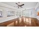 Bright and airy living room with multiple windows, doors leading to a patio, and hardwood floors at 5427 Trentham Dr, Atlanta, GA 30338