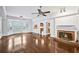 Spacious living room with hardwood floors, a fireplace, and a large bay window providing lots of natural light at 5427 Trentham Dr, Atlanta, GA 30338