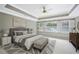Spacious main bedroom with decorative ceiling, ceiling fan, and plantation shutters at 5427 Trentham Dr, Atlanta, GA 30338