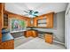 Bright office space featuring custom wooden built-in desk and shelving with a ceiling fan at 5427 Trentham Dr, Atlanta, GA 30338