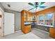 Cozy office space with wooden built-in desk and shelves next to large windows at 5427 Trentham Dr, Atlanta, GA 30338