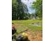 Spacious backyard offers plenty of green space and outdoor activities at 616 Burnt Creek Nw Way, Lilburn, GA 30047