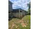 Backyard view features a covered patio and a cinder block foundation at 616 Burnt Creek Nw Way, Lilburn, GA 30047