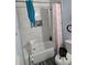 Updated bathroom features white tub, toilet, and stylishly tiled walls at 616 Burnt Creek Nw Way, Lilburn, GA 30047