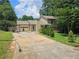 Charming home features a garage, driveway, and a well-manicured front yard at 616 Burnt Creek Nw Way, Lilburn, GA 30047