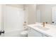 Bright bathroom with white subway tile, modern vanity, and gold fixtures at 164 Palm St, Holly Springs, GA 30188