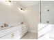 Modern bathroom with double sink vanity with marble floor and countertops and a tiled shower with glass door at 164 Palm St, Holly Springs, GA 30188