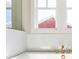 Tub featuring gold fixtures and a view from a window at 164 Palm St, Holly Springs, GA 30188