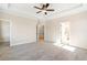 Spacious bedroom with plush carpeting, ceiling fan, and ensuite bathroom at 164 Palm St, Holly Springs, GA 30188