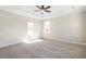 Bright bedroom with fan and neutral paint and carpet at 164 Palm St, Holly Springs, GA 30188