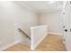 Hallway with wood floors and white trim at 164 Palm St, Holly Springs, GA 30188