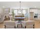 Bright living room featuring wood floors, white trim and neutral walls at 164 Palm St, Holly Springs, GA 30188