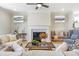 Beautiful living room with fireplace, comfortable seating, and elegant decor at 164 Palm St, Holly Springs, GA 30188