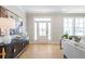 Bright living room featuring modern decor, hardwood floors, and a welcoming atmosphere at 164 Palm St, Holly Springs, GA 30188