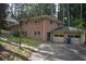 This house has a brick exterior, attached garage, and a basketball hoop near the driveway at 3798 King Henry Sw Rd, Atlanta, GA 30331