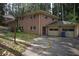 This house has a brick exterior, attached garage, and a basketball hoop near the driveway at 3798 King Henry Sw Rd, Atlanta, GA 30331