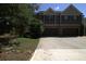 Inviting two-story home featuring a two-car garage and traditional architecture at 4746 Highland Ave, Sugar Hill, GA 30518