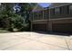 Two-story home featuring a two-car garage and traditional architecture, with a large driveway at 4746 Highland Ave, Sugar Hill, GA 30518