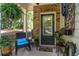 Cozy front porch with seating and decorative plants for a relaxing entrance at 4746 Highland Ave, Sugar Hill, GA 30518