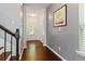 Inviting hallway with hardwood floors, neutral walls, and ample natural light at 4746 Highland Ave, Sugar Hill, GA 30518