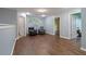Open living room features hardwood floors, recessed lighting, and several doorways at 4746 Highland Ave, Sugar Hill, GA 30518
