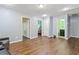 Open living room features hardwood floors, recessed lighting, and doorways to other rooms at 4746 Highland Ave, Sugar Hill, GA 30518