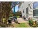 Back patio with a table and seating, a grill, and landscaping at 4746 Highland Ave, Sugar Hill, GA 30518