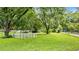 Expansive backyard featuring a large grassy area and mature trees, perfect for outdoor activities at 5599 Redan Cir, Stone Mountain, GA 30088