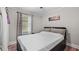 Cozy bedroom with a bed, neutral walls, window with curtains, and modern decor at 5599 Redan Cir, Stone Mountain, GA 30088