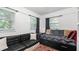 Cozy bedroom with built-in storage and large windows for great natural light at 5599 Redan Cir, Stone Mountain, GA 30088