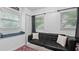 Bright bedroom featuring ample light, built in storage and a serene window seat at 5599 Redan Cir, Stone Mountain, GA 30088