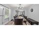 Bright dining room with a large table, seating for eight, and views into the living room at 5599 Redan Cir, Stone Mountain, GA 30088
