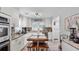 Bright kitchen boasts white cabinets, granite countertops, stainless steel appliances and center island at 5599 Redan Cir, Stone Mountain, GA 30088
