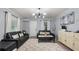 Inviting living space with modern lighting, wood-look floors, and comfortable seating area at 5599 Redan Cir, Stone Mountain, GA 30088