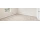 Bright carpeted bedroom with window and door at 7254 Deering Court Lot 177, Douglasville, GA 30134