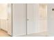 Hallway features a view of a bathroom with double vanity and a bedroom with open doors at 7254 Deering Court Lot 177, Douglasville, GA 30134